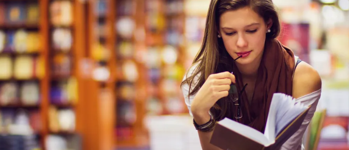 Woman reading a book thoughtfully