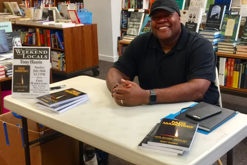 Tony Harris at Warwick's signing books