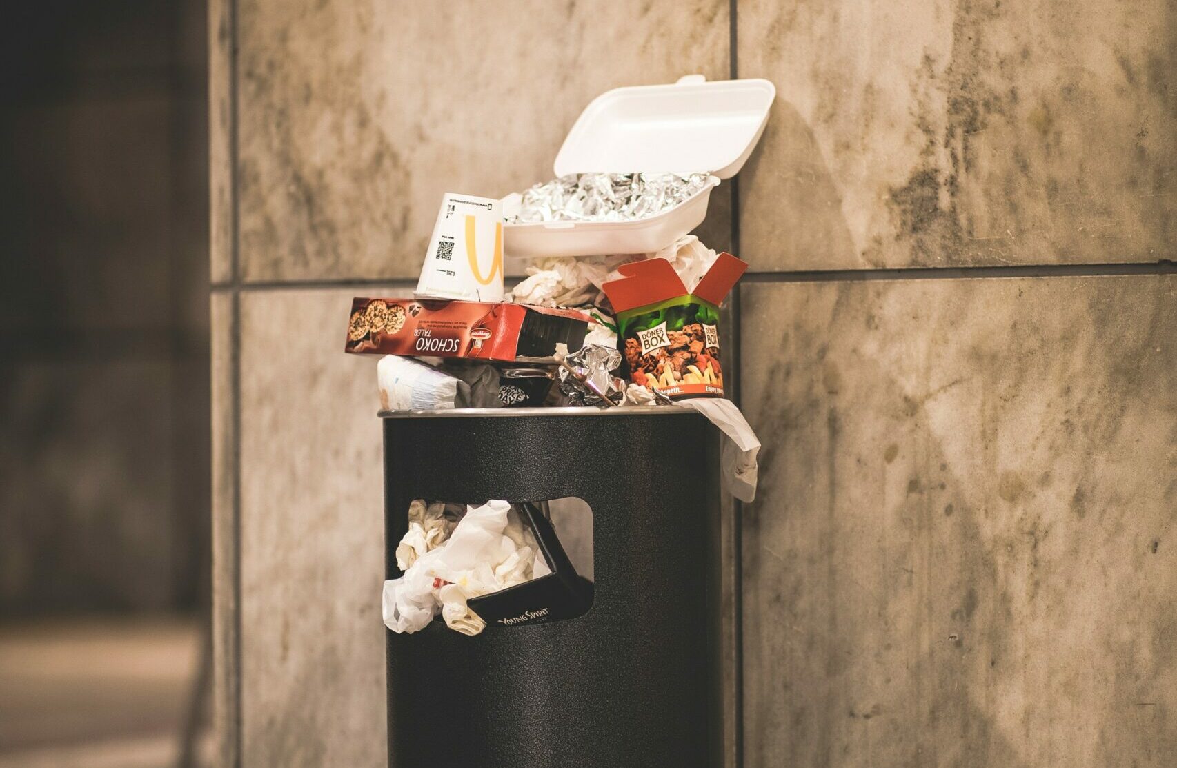 food waste overflows in the trash
