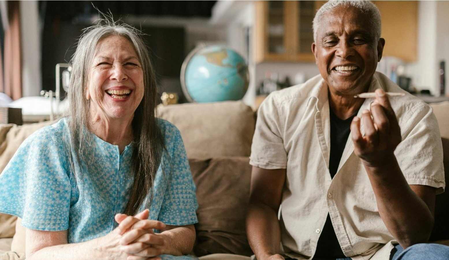 elderly woman and man share a joint