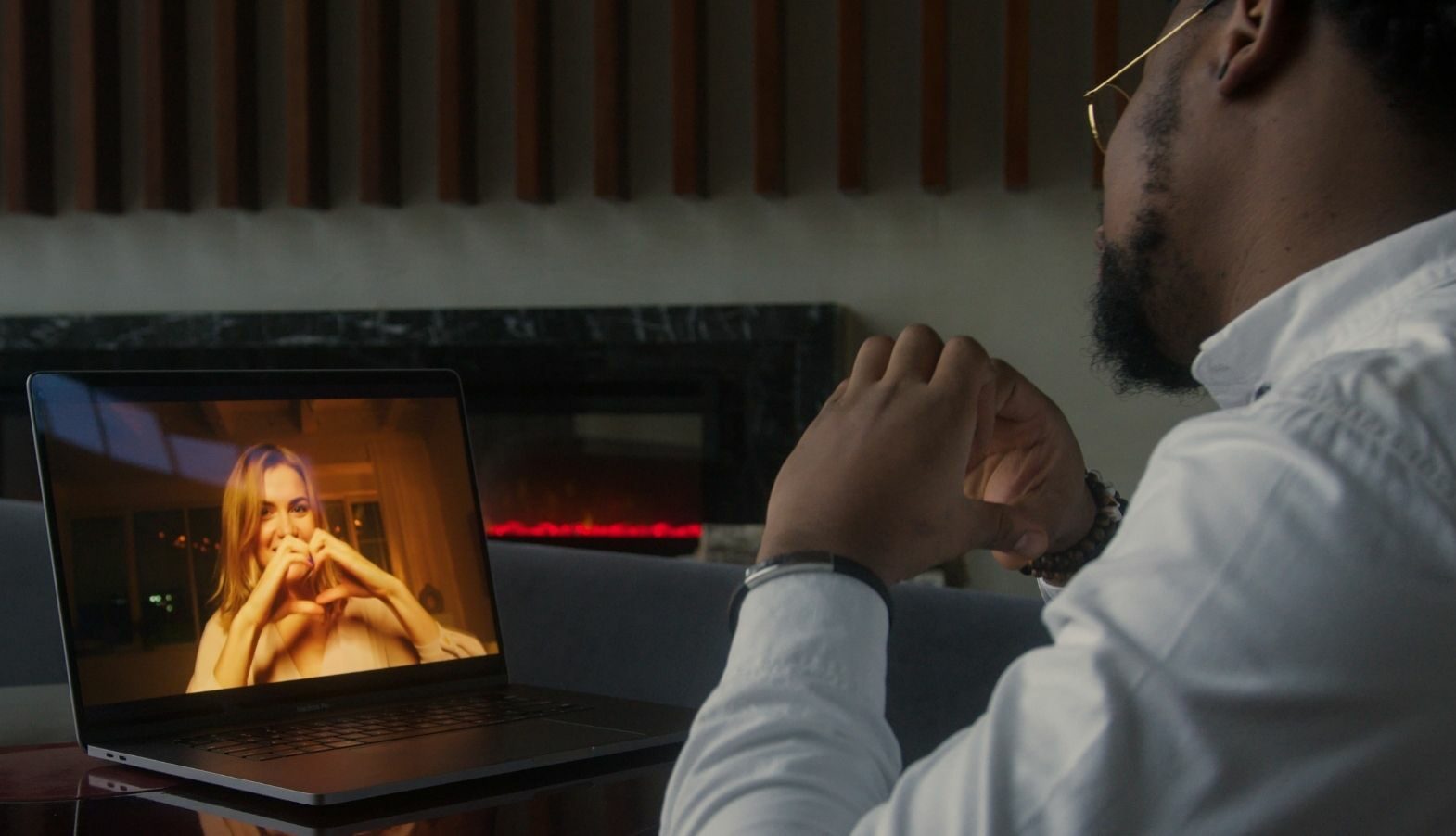 man and woman on a virtual date over a computer