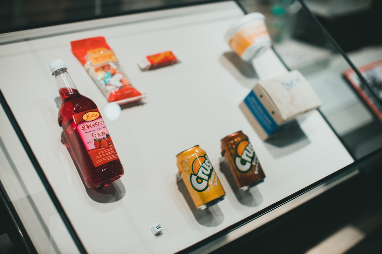 Food products under glass in a lab showcasing their marketing and brand messages